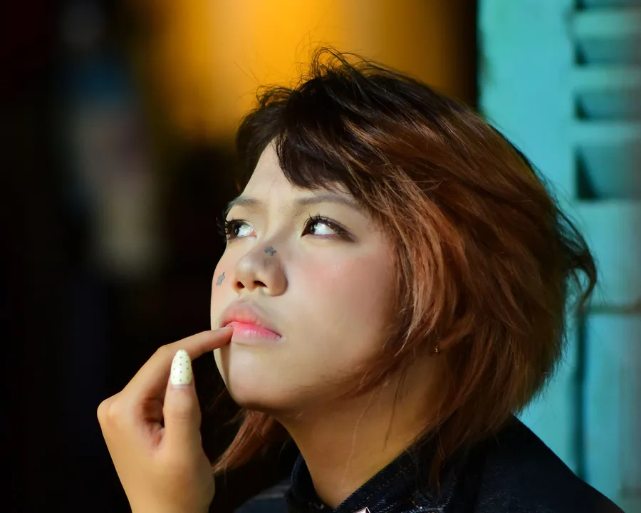 A woman pausing, lost in thought